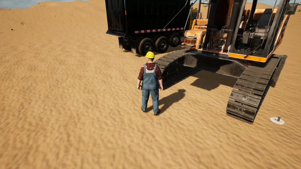 A worker in a hard hat beside the excavator and a dump truck