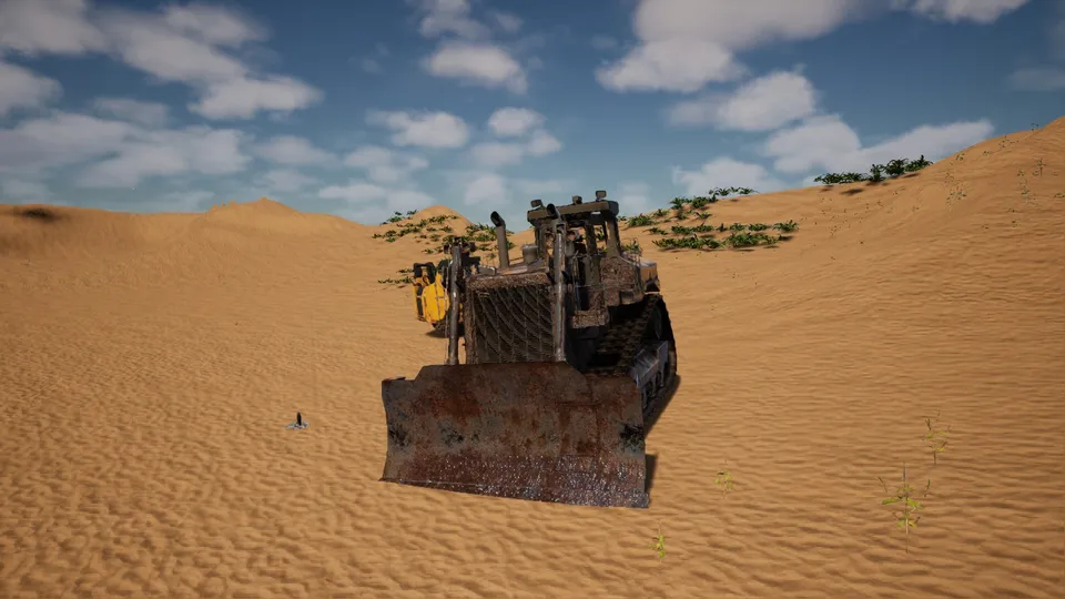 A bulldozer with its blade forward on the sand